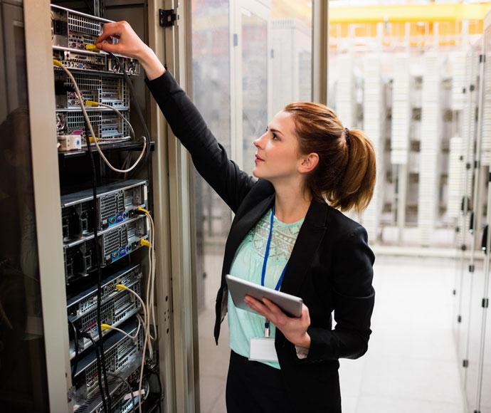 Woman working on server cables